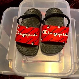 Red and black champion slides size 7
